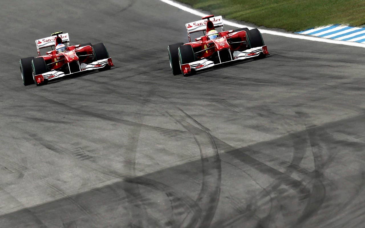 Ferrari's Brazilian Felipe Massa drives ahead of Ferrari's Spanish driver Fernando Alonso at the Hockenheimring circuit on July 25, 2010 in Hockenheim, during the Formula One German Grand Prix.            AFP PHOTO / GUILLAUME BAPTISTE (Photo credit should read GUILLAUME BAPTISTE/AFP/Getty Images)
