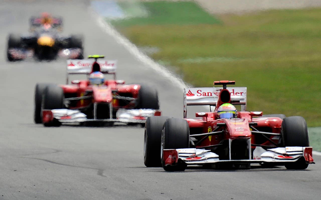 Ferrari's  Felipe Massa of Brazil  leads in front of Fernando Alonso of Spain , and Red Bull driver Sebastian Vettel, from Germany during the German Formula One Grand Prix in Hockenheim, Germany,  Sunday, July 25, 2010. (AP Photo/Martin Meissner)