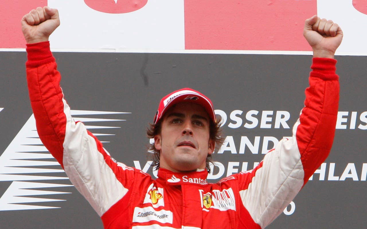 Ferrari Formula One driver Fernando Alonso of Spain celebrates after winning the German F1 Grand Prix in Hockenheim,  Germany, Sunday, July 25, 2010. (AP Photo/Michael Probst)