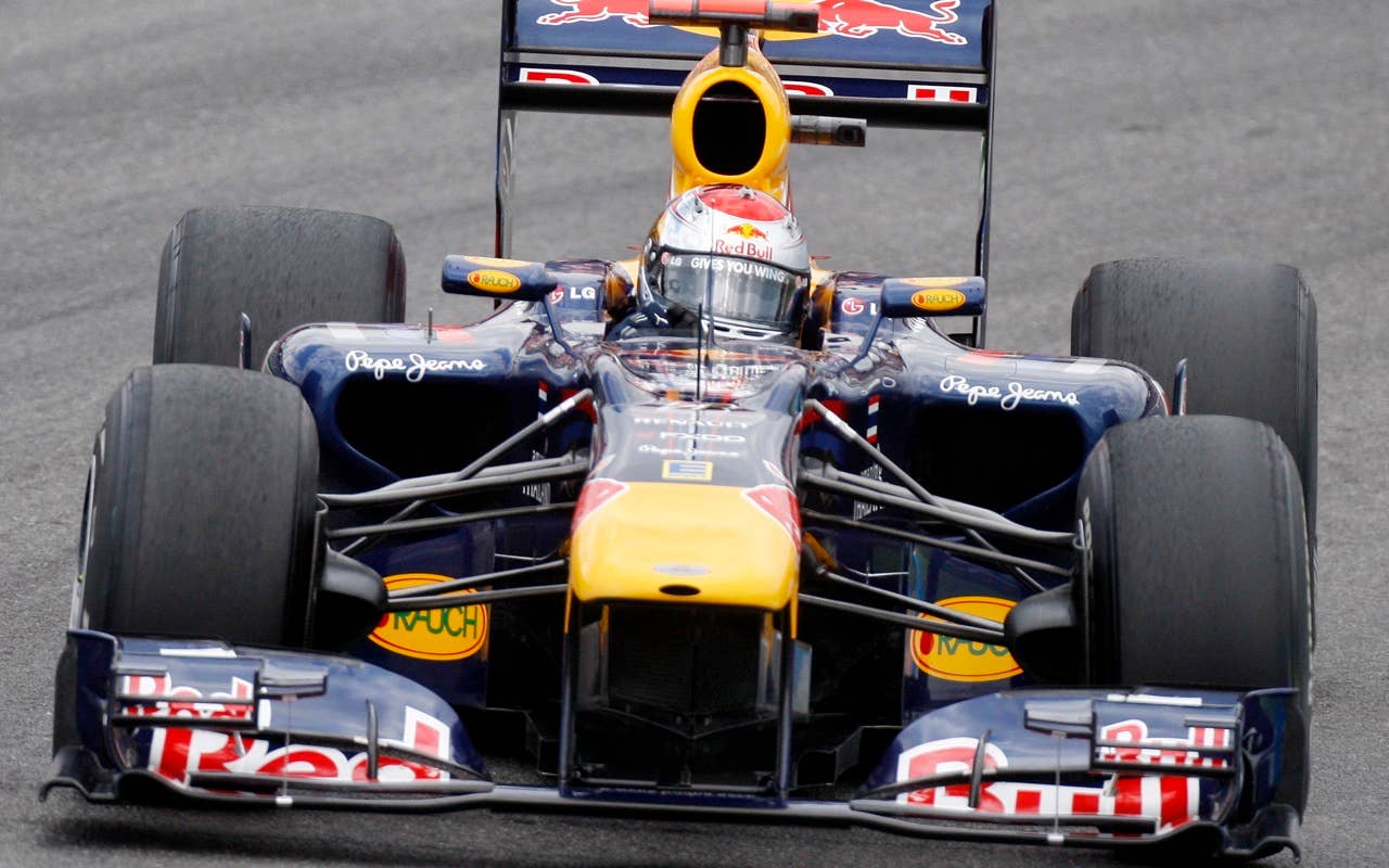 Red Bull Formula 1 driver Sebastian Vettel of Germany steers his car to win the Qualifying at the race track in Hockenheim,  Germany, July 24, 2010. The race will take place on Sunday(AP Photo/Michael Probst)