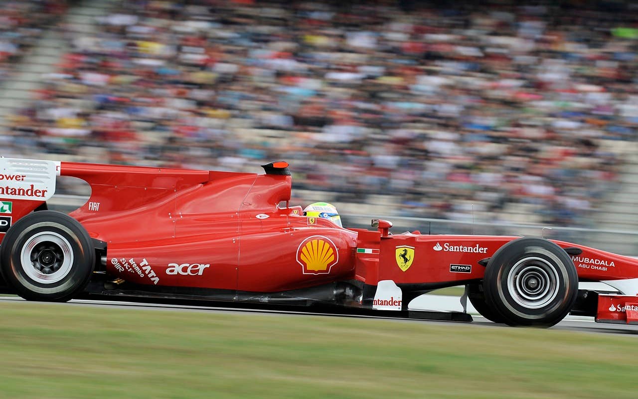 Ferrari Formula One driver Felipe Massa of Brazil finishes third palce during the Qualifying at the race track in Hockenheim, Germany, Saturday, July 24, 2010.   Sebastian Vettel of Germany has edged Fernando Alonso  to take pole position for the Formula One German Grand Prix. Vettel's  Red Bull was .002 seconds faster than Alonso's Ferrari on Saturday to give the German his sixth pole of the season.  Felipe Massa of Brazil in the second Ferrari, who was third, and Mark Webber in the second Red Bull complete the two front rows for Sunday's race. (AP Photo/Martin Meissner)