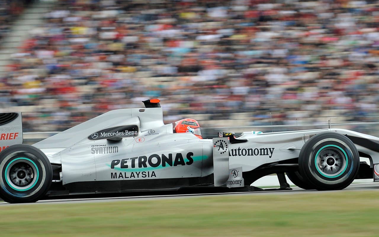 Mercedes Formula One driver Michael Schumacher drives during the qualifying at the race track in Hockenheim, Germany, Saturday, July 24, 2010. Schumacher placed 11th.  Sebastian Vettel of Germany has edged Fernando Alonso  to take pole position for the Formula One German Grand Prix. Vettel's  Red Bull was .002 seconds faster than Alonso's Ferrari on Saturday to give the German his sixth pole of the season.  Felipe Massa of Brazil in the second Ferrari, who was third, and Mark Webber in the second Red Bull complete the two front rows for Sunday's race.  (AP Photo/Martin Meissner)