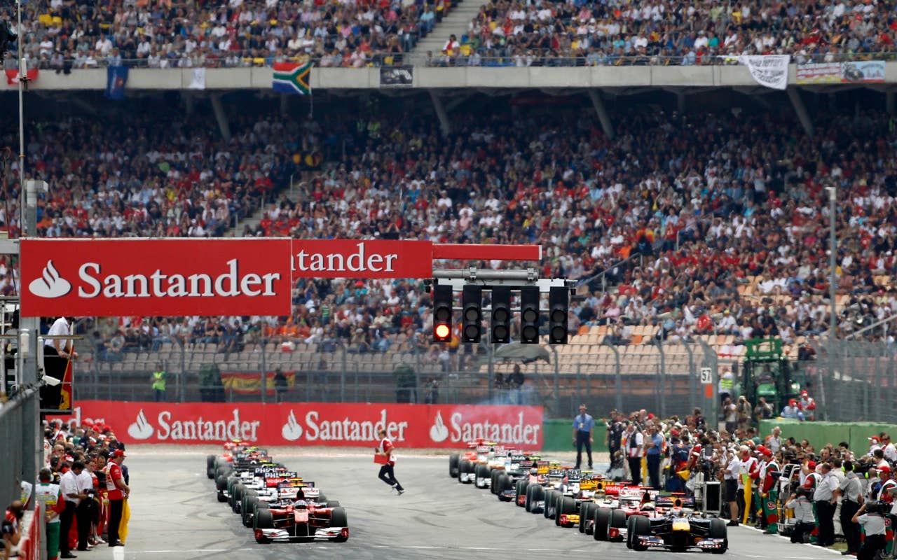 Race cars build the pack that waits for the start to the German Formula One Grand Prix in Hockenheim, Germany, Sunday, July 25, 2010. (AP Photo/Matthias Schrader)