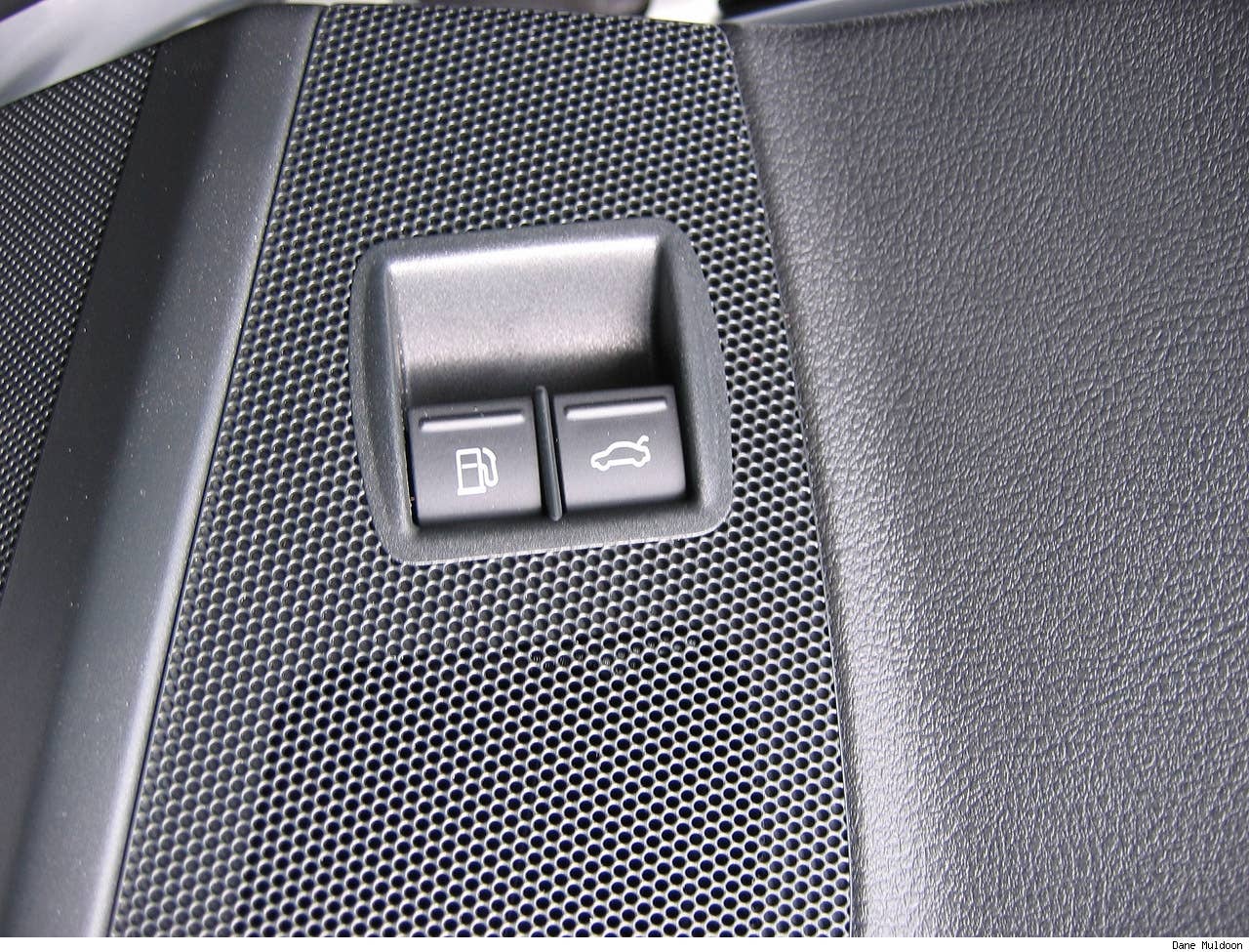 Fuel cap release and boot release very close together