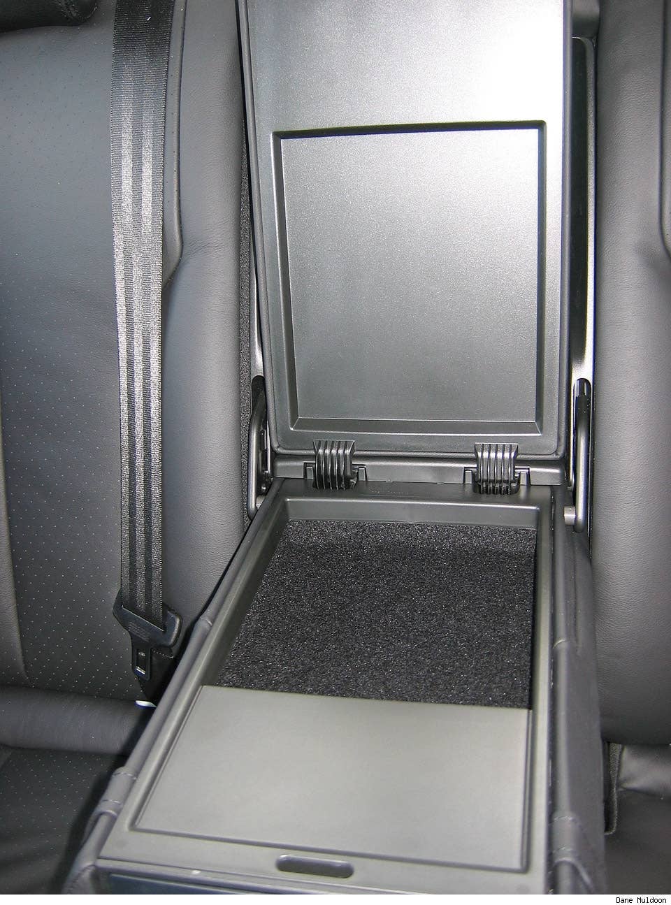 Rear arm rest has a small amount of storage - about enough for a CD case