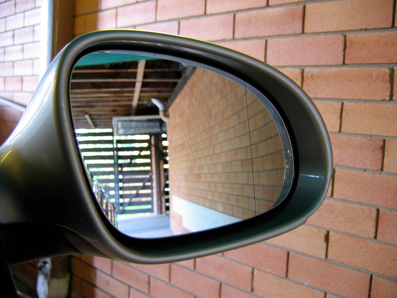 Now this is a good idea - past the vertical dotted line on the right wing mirror, the mirror distorts to give you a better view of your blind spot