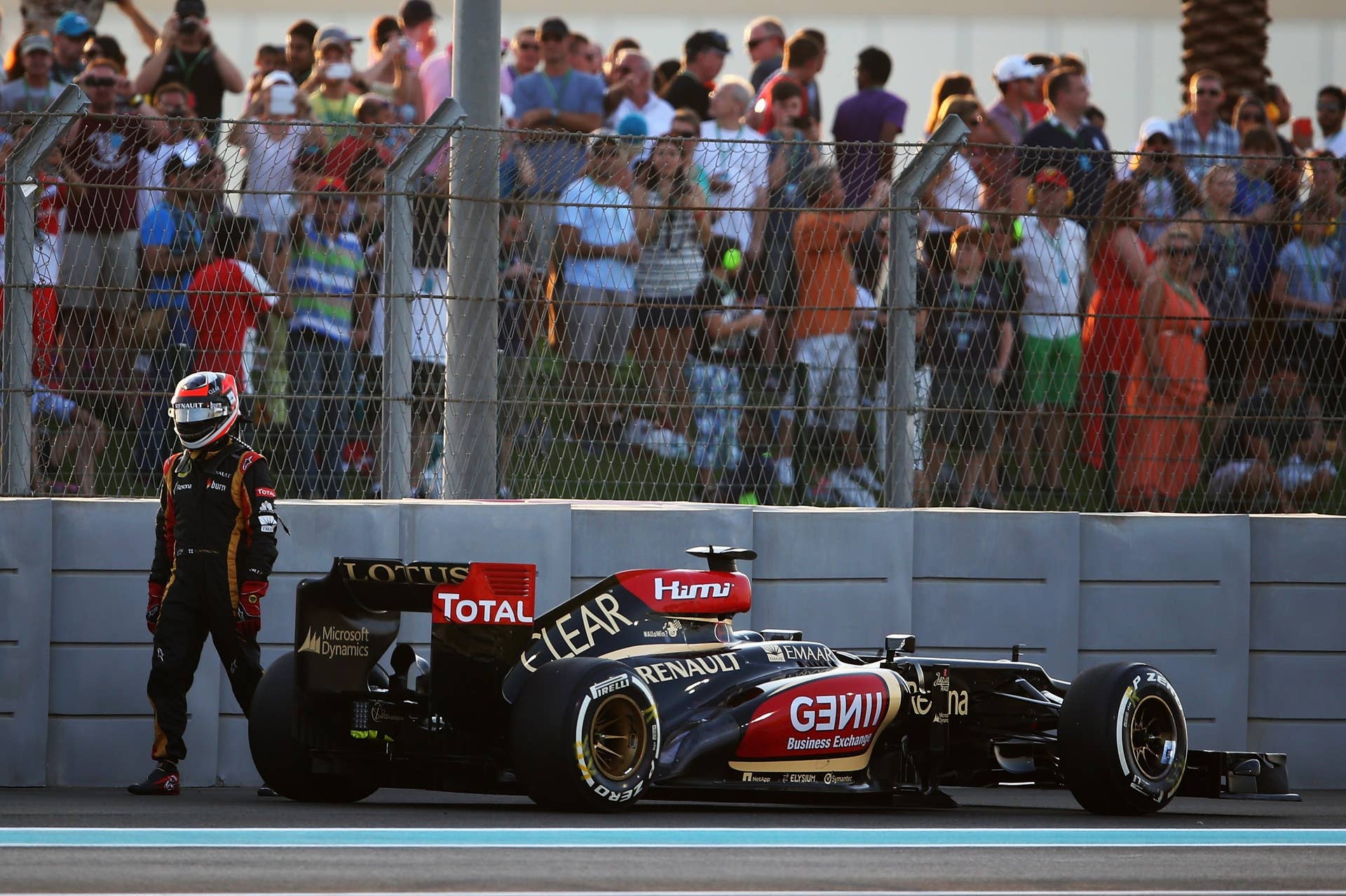 ABU DHABI, UNITED ARAB EMIRATES - NOVEMBER 03:  Kimi Raikkonen of Finland and Lotus retires from the race on lap one of the Abu Dhabi Formula One Grand Prix at the Yas Marina Circuit on November 3, 2013 in Abu Dhabi, United Arab Emirates.  (Photo by Paul Gilham/Getty Images)