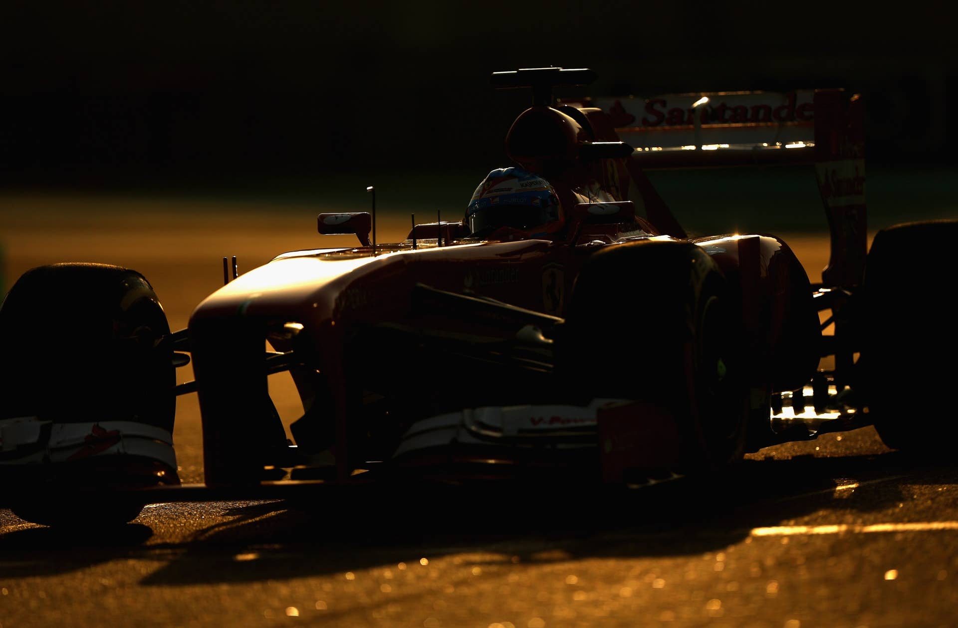 ABU DHABI, UNITED ARAB EMIRATES - NOVEMBER 03: Fernando Alonso of Spain and Ferrari drives during the Abu Dhabi Formula One Grand Prix at the Yas Marina Circuit on November 3, 2013 in Abu Dhabi, United Arab Emirates. (Photo by Paul Gilham/Getty Images)