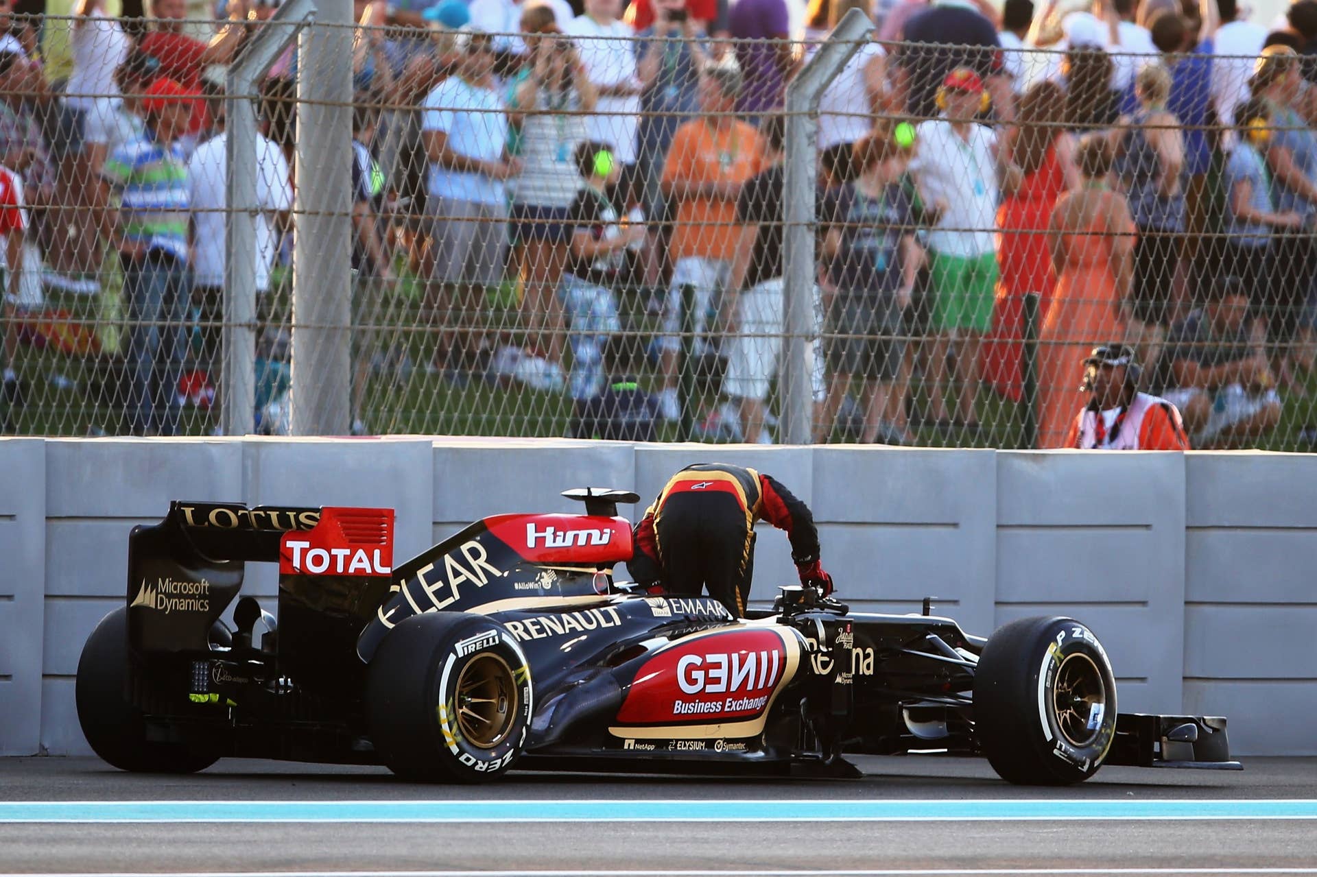 ABU DHABI, UNITED ARAB EMIRATES - NOVEMBER 03:  Kimi Raikkonen of Finland and Lotus retires from the race on lap one of the Abu Dhabi Formula One Grand Prix at the Yas Marina Circuit on November 3, 2013 in Abu Dhabi, United Arab Emirates.  (Photo by Paul Gilham/Getty Images)