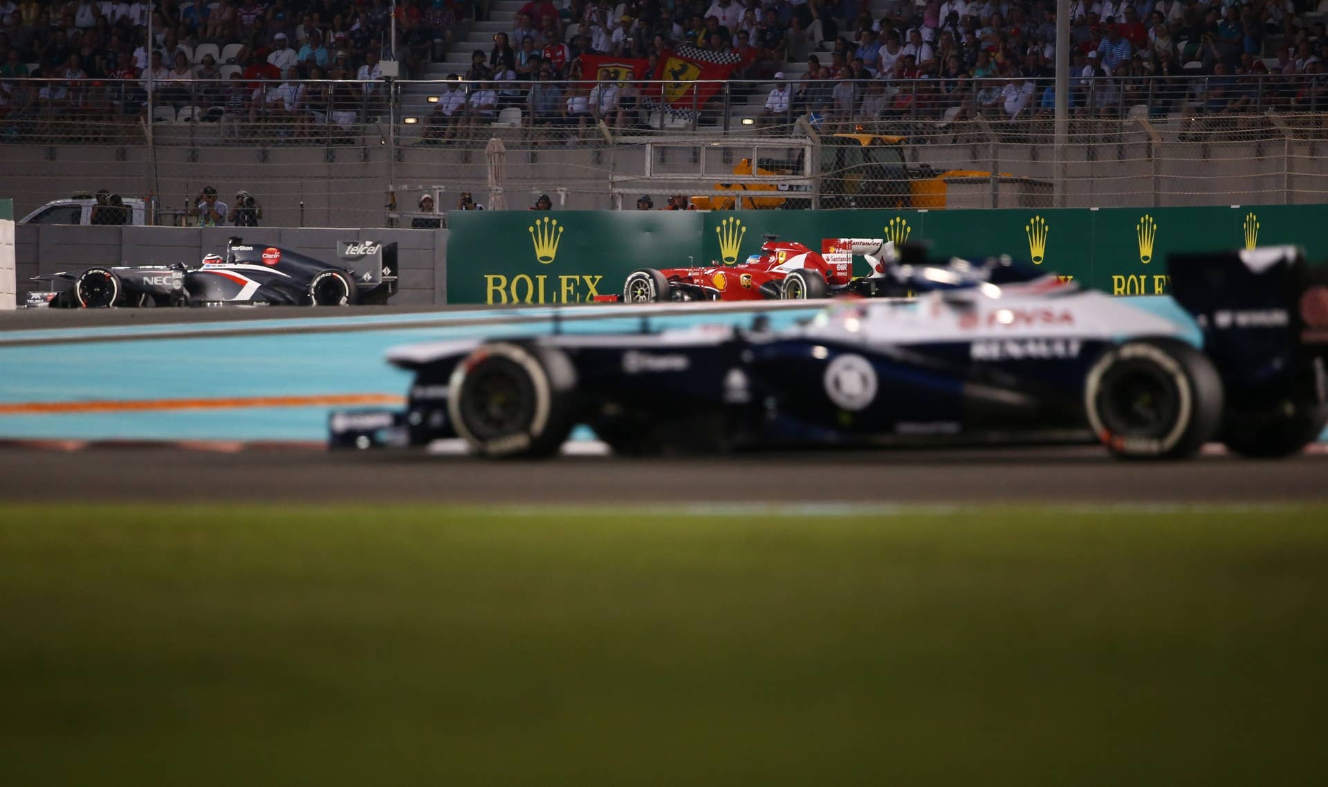 (L to R) Sauber's German driver Nico Hulkenberg, Ferrari's Spanish driver Fernando Alonso and William's Venezuelan driver Pastor Maldonado  drives at the Yas Marina circuit in Abu Dhabi on November 3, 2013 during the Abu Dhabi Formula One Grand Prix.    AFP PHOTO / MARWAN NAAMANI        (Photo credit should read MARWAN NAAMANI/AFP/Getty Images)