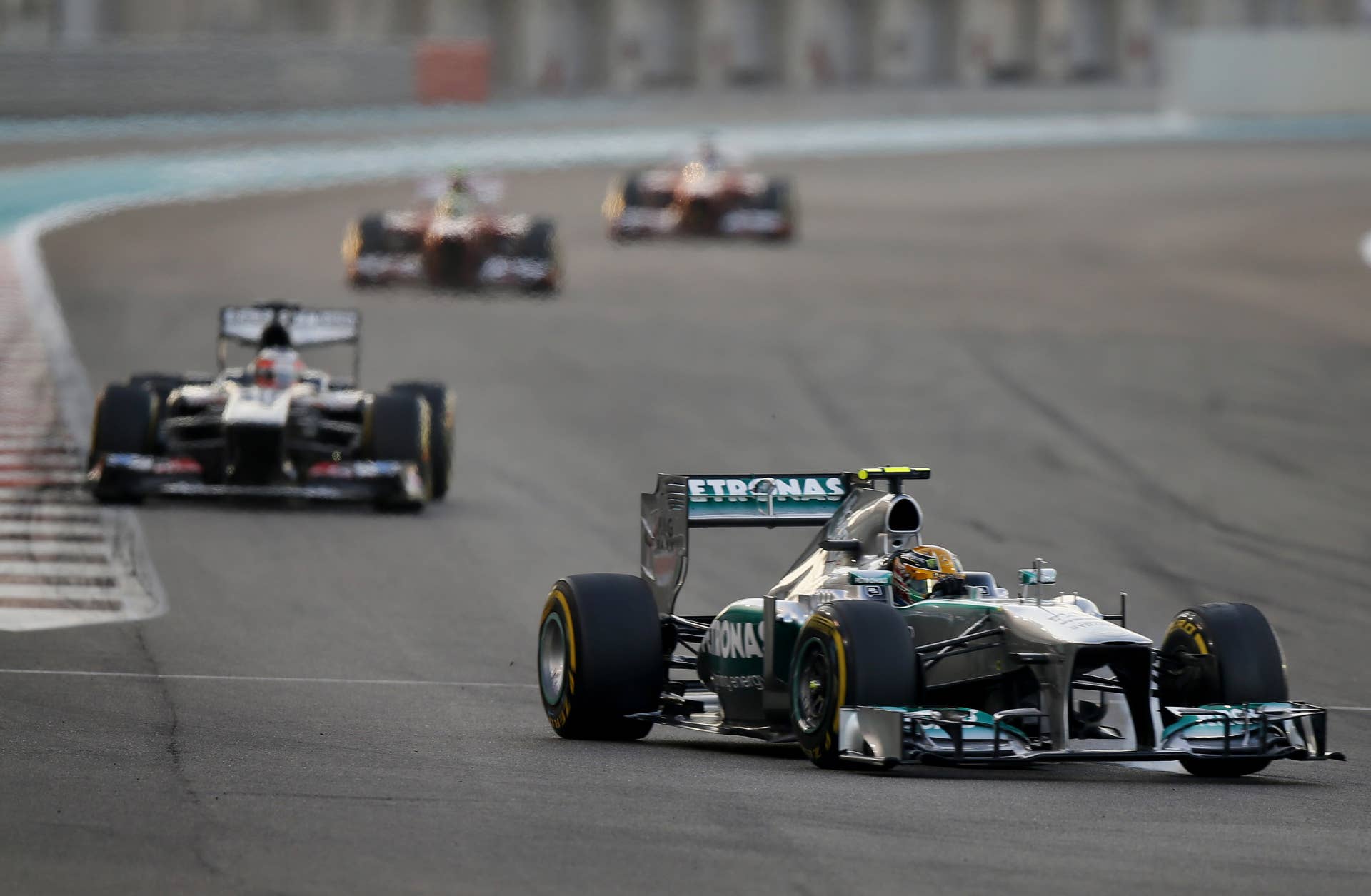 Mercedes'  British driver Lewis Hamilton drives at the Yas Marina circuit in Abu Dhabi on November 3, 2013 during the Abu Dhabi Formula One Grand Prix.  AFP PHOTO / KARIM SAHIB        (Photo credit should read KARIM SAHIB/AFP/Getty Images)