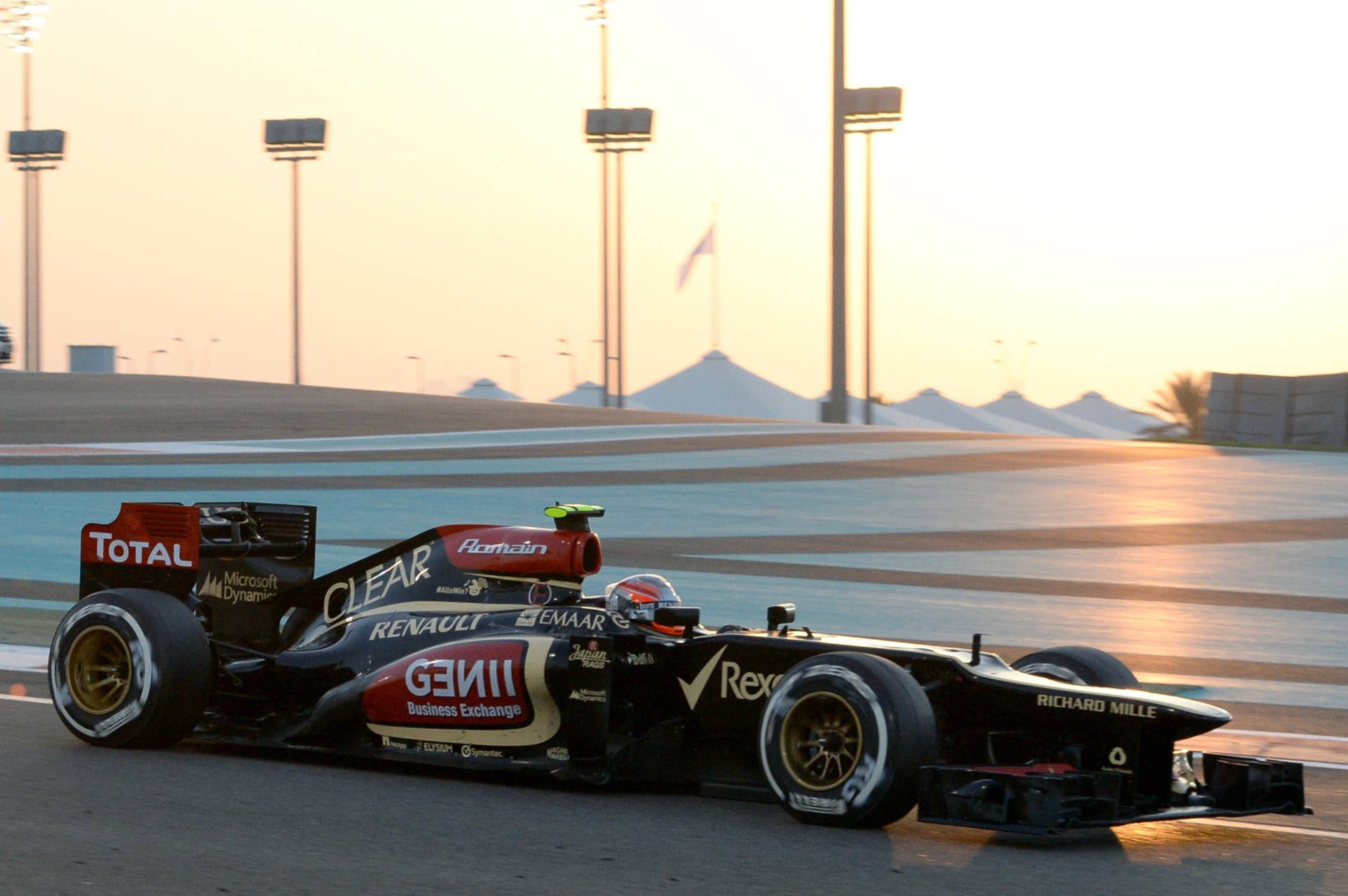 Lotus F1 Team's French driver Romain Grosjean drives at the Yas Marina circuit in Abu Dhabi on November 3, 2013 during the Abu Dhabi Formula One Grand Prix.  AFP PHOTO / TOM GANDOLFINI        (Photo credit should read Tom Gandolfini/AFP/Getty Images)