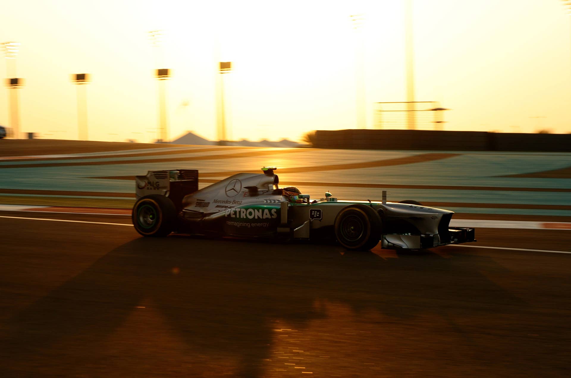 Mercedes' British driver Lewis Hamilton drives at the Yas Marina circuit in Abu Dhabi on November 3, 2013 during the Abu Dhabi Formula One Grand Prix. AFP PHOTO / TOM GANDOLFINI        (Photo credit should read Tom Gandolfini/AFP/Getty Images)