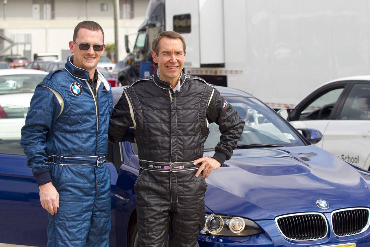 Jeff Koons und der Motorsport Manager BMW of North America, Martin Birkmann in at Sebring International Raceway on February 23, 2010 (02/2010)