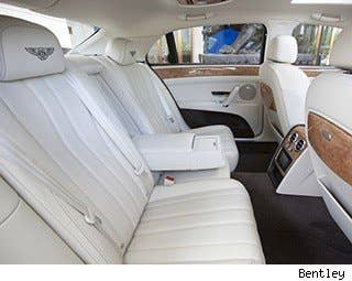 Let's face it, this car was designed for people who want to be chauffeured. So there's ample legroom in the back. There's also a tray that flips down, like in an airplane, in case you want to do work. And there's a mirror, for those vanity moments. The rear seats are heated and there's optional seat massagers in the back.  There's a sturdy arm rest in between the back seats, so the car only seats four.  The trunk is big enough to carry golf clubs and a steamer trunk or two (isn't that how rich people travel? Or have they moved on to matching sets of Louis Vitton suitcases?).