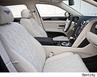 This is where things get ultra luxurious. I've always been struck by how really wealthy people favor colors like white and beige, as if these people never get muddy or spill Diet Coke while they're driving. The Flying Spur we tested favored these light hues – seats in quilted off-white leather and plush cream carpeting are suitable for folks who don't have to carpool kids snacking on Cheez-Its in plastic baggies. That said, you can get it with darker interior colors if that's your thing.  It's lavish. People who own this car have nannies who dole out organic Cheez-Its and deal with that mess. The fine wood paneling and cold-to-the-touch gear selector and rotary dial add to the cocoon feeling inside the car. In the Mulliner edition, which is the $250,000 version of the car, there's a removable sunglasses case that matches the wood in the car. It's nicer than almost anything I own.