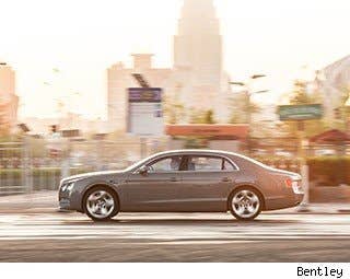 If you stick some miniature flags to the four corners of this car, you could easily pass as a third-world dictator driving through town.  The Flying Spur is classically Bentley – a bit staid, but respectable. The lattice-work grill and sparkling headlights give the car a distinguished face. On the side, air vents are covered with a stylish "B" that looks like a rocket ship. Thick pillars between the windows give the car a heavy, strong look.  Bentley cars can be painted in whatever color you like; if you want the automaker to match your car to your favorite dress, they can do it. There are 88 standard colors available, joined now by a purple called Damson inspired by the color of rare purple diamonds, the company says.  I like how it looks. It's a proper grown up car -- one you could drive to charity galas and feel like you've made it.