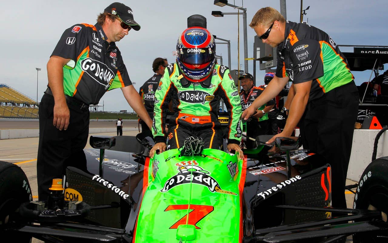 Danica Patrick, driver of the #7 Team Godaddy.com Andretti Autosport Dallara Honda, sit in her car during practice for the IRL Indycar Series Iowa Corn Indy 250 on June 19, 2010 at the Iowa Speedway in Newton, Iowa.
