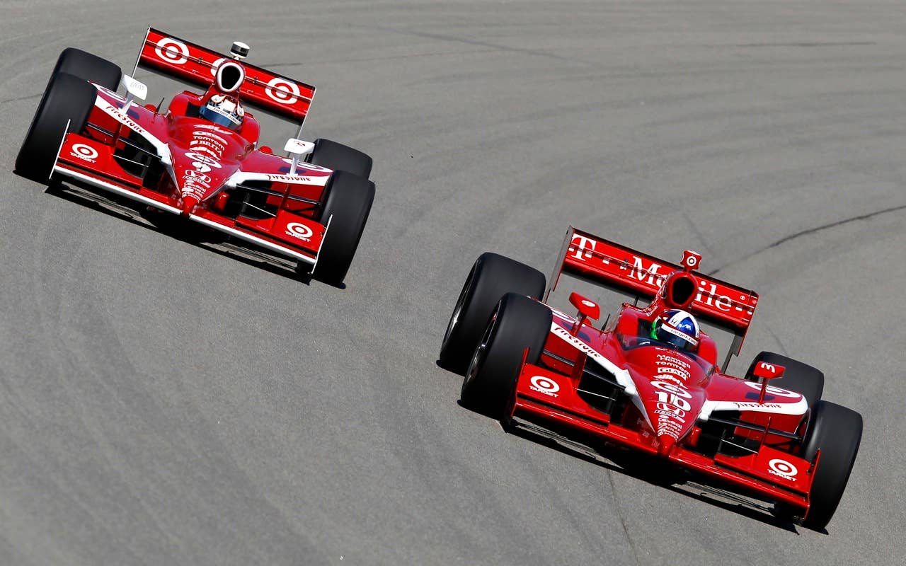 Dario Franchitti of Scotland, driver of the #10 Target Chip Ganassi Racing Dallara Honda, leads teammate Scott Dixon of New Zealand, driver of the #9 Target Chip Ganassi Racing Dallara Honda during practice for the IRL Indycar Series Iowa Corn Indy 250 on June 19, 2010 at the Iowa Speedway in Newton, Iowa.
