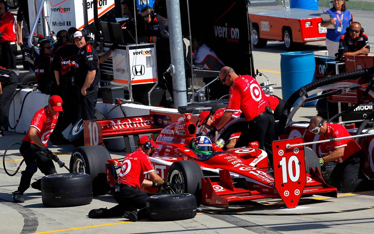 Dario Franchitti of Scotland, driver of the #10 Target Chip Ganassi Racing Dallara Honda, pits during practice for the IRL Indycar Series Iowa Corn Indy 250 on June 19, 2010 at the Iowa Speedway in Newton, Iowa.