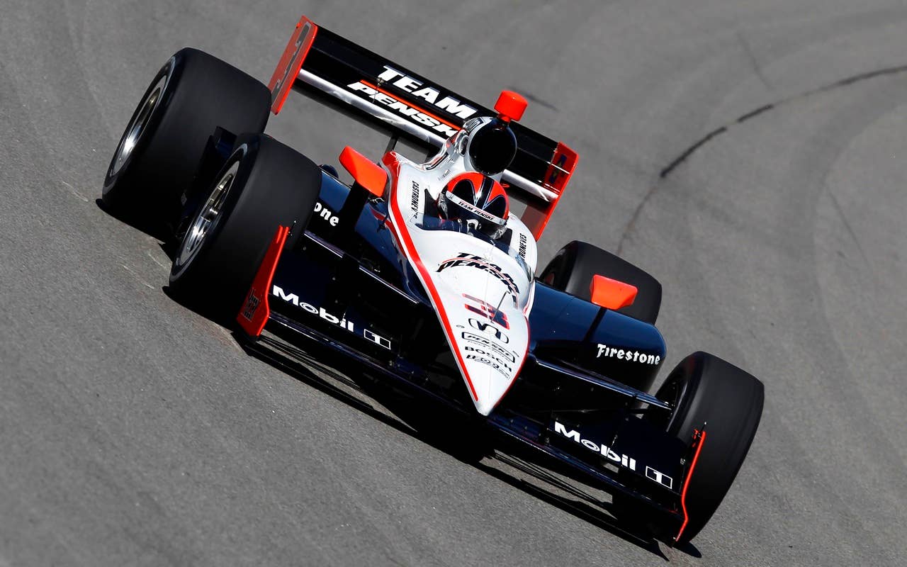 Helio Castroneves drives the #3 Team Penske Dallara Honda, during practice for the IRL Indycar Series Iowa Corn Indy 250 on June 19, 2010 at the Iowa Speedway in Newton, Iowa.