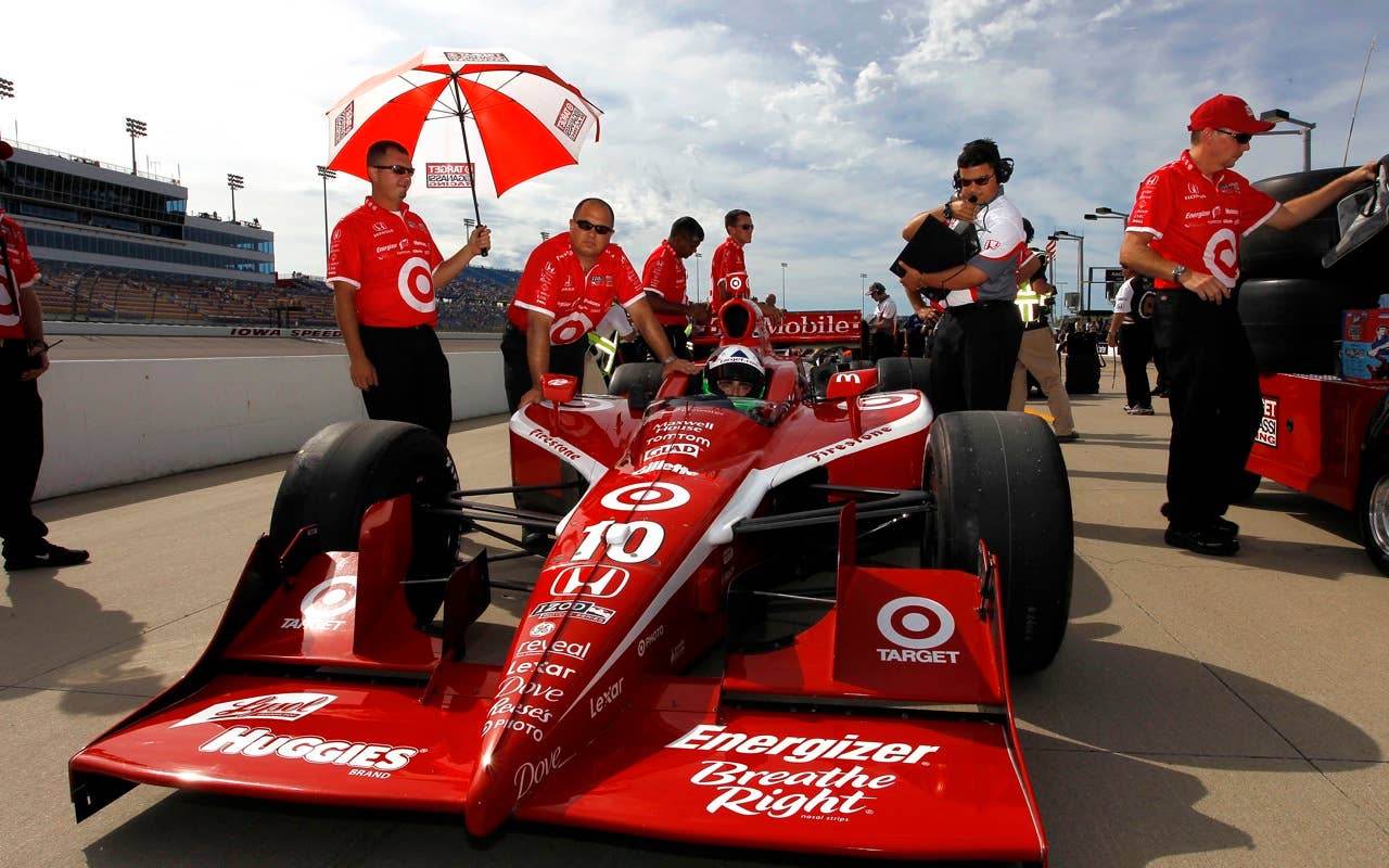 Dario Franchitti of Scotland, driver of the #10 Target Chip Ganassi Racing Dallara Honda, sits in his car during qualifying for the IRL Indycar Series Iowa Corn Indy 250 on June 19, 2010 at the Iowa Speedway in Newton, Iowa.