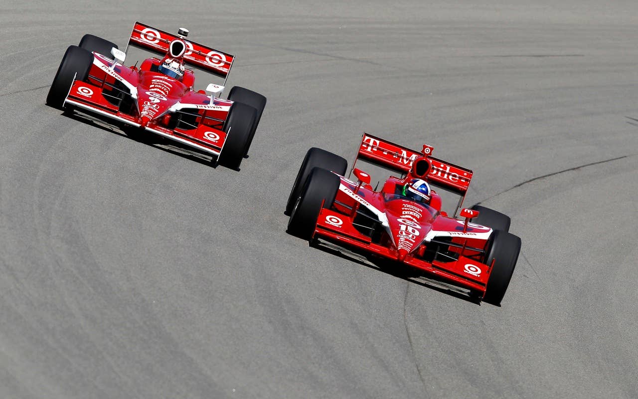 Dario Franchitti of Scotland, driver of the #10 Target Chip Ganassi Racing Dallara Honda, leads teammate Scott Dixon of New Zealand, driver of the #9 Target Chip Ganassi Racing Dallara Honda during practice for the IRL Indycar Series Iowa Corn Indy 250 on June 19, 2010 at the Iowa Speedway in Newton, Iowa.