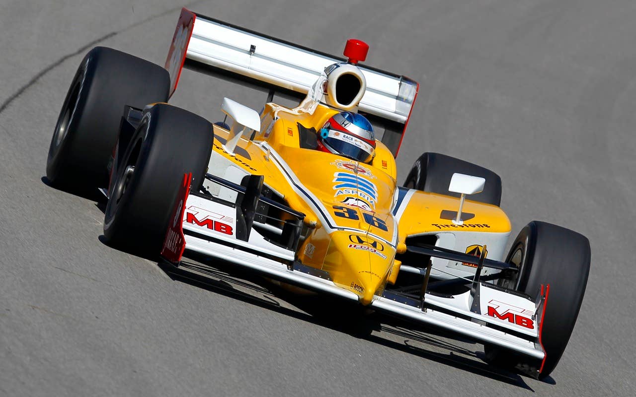 Bertrand Baguette of Belgium, driver of the #36 Conquest Racing Dallara Honda, drives during practice for the IRL Indycar Series Iowa Corn Indy 250 on June 19, 2010 at the Iowa Speedway in Newton, Iowa.
