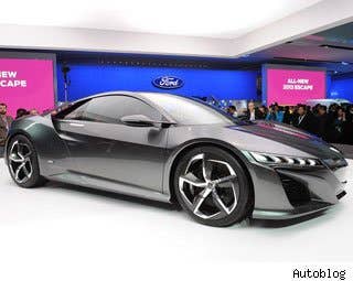 AutoBlog says: The Acura NSX is still a couple years away from production (isn't it always?), but Acura has taken the dark window tint off last year's concept and opened the doors to show us what the interior of the car looks like. From what we can tell on the show-floor display, Acura's hybrid supercar will not only have a sexy exterior design, it will look great from the inside as well, but Acura pointed out that this is just "one possible direction" the interior could go. We suppose that means we can look forward to many more NSX concepts – you won't hear any complaints from us.  Read More Acura NSX Info Acura NSX Photos