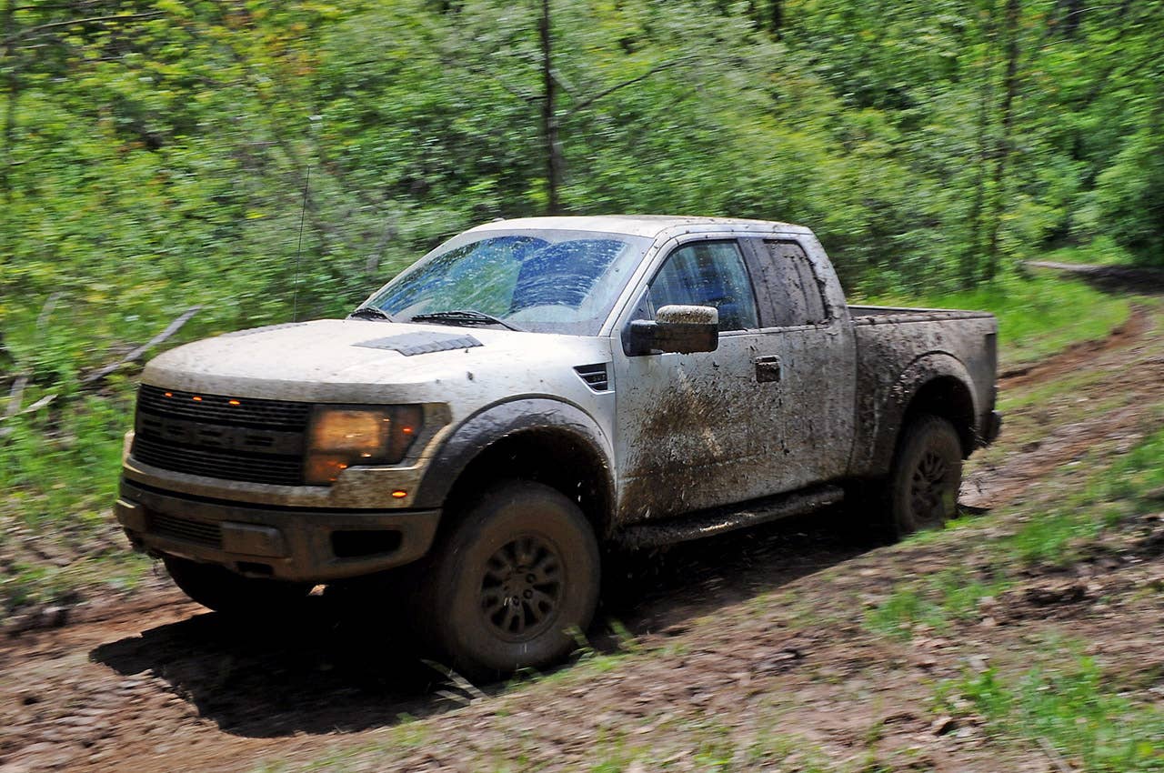 ROMEO, MI. MAY 14, 2010--2010 F-150 SVT Raptor --The 2010 F-150 SVT Raptor, equipped with the optional all-new 6.2-liter engine, hitting the woods. Photo by:  Sam VarnHagen/Ford Motor Co.
