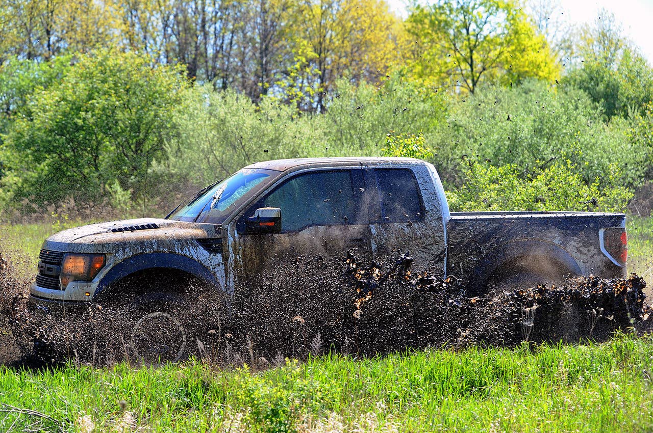 ROMEO, MI. MAY 14, 2010--2010 F-150 SVT Raptor --The 2010 F-150 SVT Raptor, equipped with the optional all-new 6.2-liter engine, hitting the woods. Photo by:  Sam VarnHagen/Ford Motor Co.
