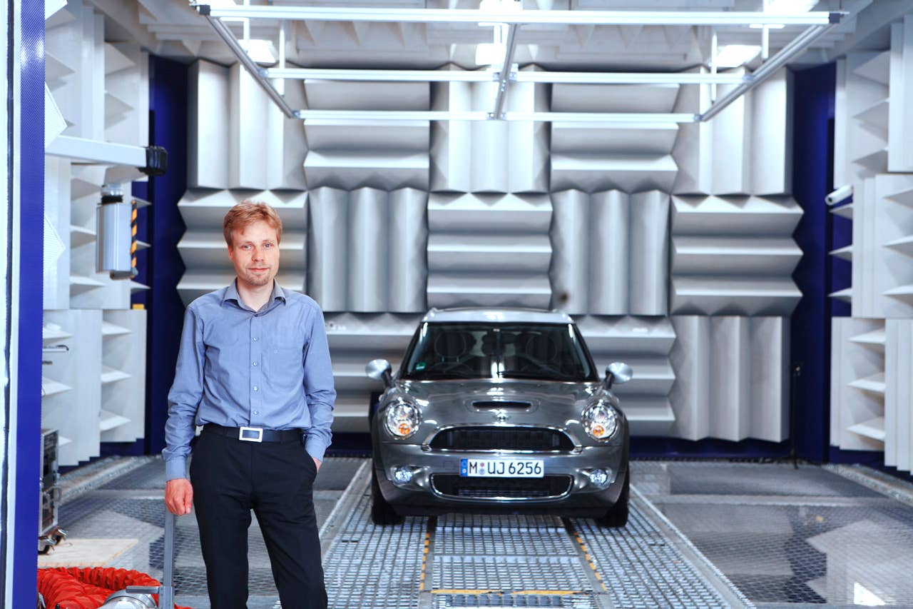 Dr. Robert Liebing, Acoustics engineer, and the MINI with Active Sound Design in the BMW Group Acoustics test bench (05/2010)