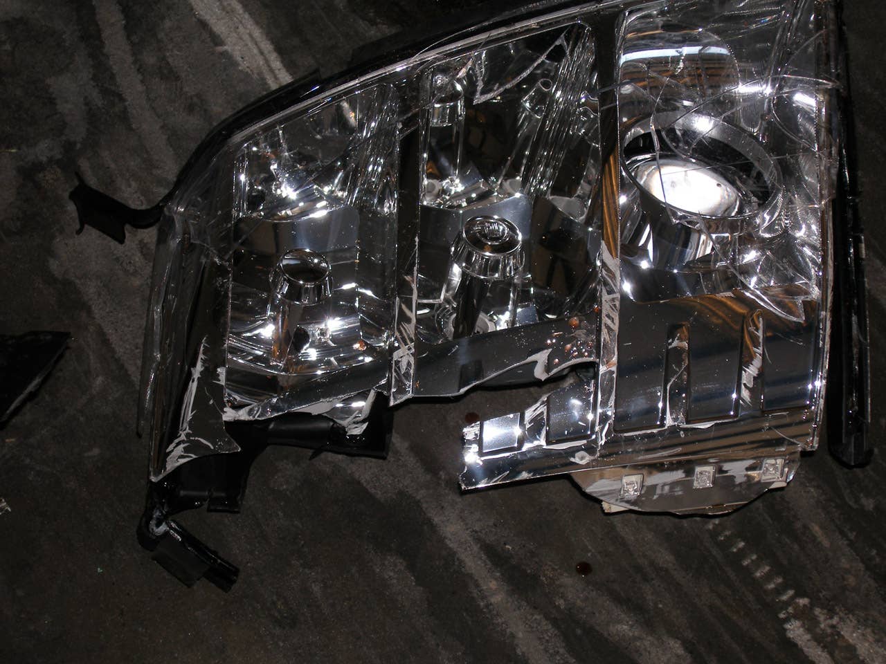 ORLANDO, FL - DECEMBER 02:  In this handout photo provided by The Florida Highway Patrol, a headlight from the vehicle driven by Tiger Woods during his accident is seen on December 2, 2009 in Orlando, Florida. Woods crashed the SUV into the fire hydrant and tree next to his Florida home in the early hours of November 27.  FHP charged Woods with careless driving which carries a $164 fine and four points on his driving record. Woods released a statement on his website saying, 'I have let my family down and I regret those transgressions with all of my heart.'.  (Photo by Florida Highway Patrol via Getty Images)