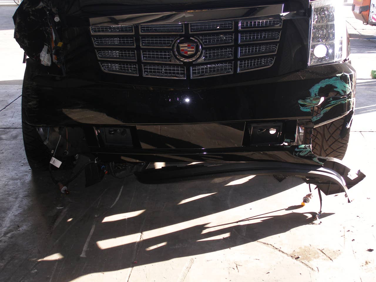 ORLANDO, FL - DECEMBER 02:  In this handout photo provided by The Florida Highway Patrol, the vehicle driven by Tiger Woods during his accident is seen on December 2, 2009 in Orlando, Florida. Woods crashed the SUV into the fire hydrant and tree next to his Florida home in the early hours of November 27.  FHP charged Woods with careless driving which carries a $164 fine and four points on his driving record. Woods released a statement on his website saying, 'I have let my family down and I regret those transgressions with all of my heart.'.  (Photo by Florida Highway Patrol via Getty Images)