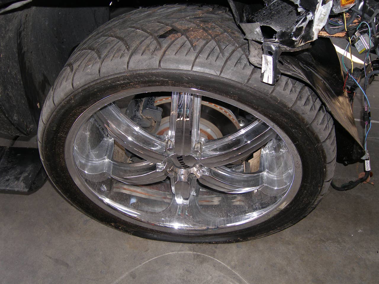 ORLANDO, FL - DECEMBER 02:  In this handout photo provided by The Florida Highway Patrol, a wheel of the vehicle driven by Tiger Woods during his accident is seen on December 2, 2009 in Orlando, Florida. Woods crashed the SUV into the fire hydrant and tree next to his Florida home in the early hours of November 27.  FHP charged Woods with careless driving which carries a $164 fine and four points on his driving record. Woods released a statement on his website saying, 'I have let my family down and I regret those transgressions with all of my heart.'.  (Photo by Florida Highway Patrol via Getty Images)