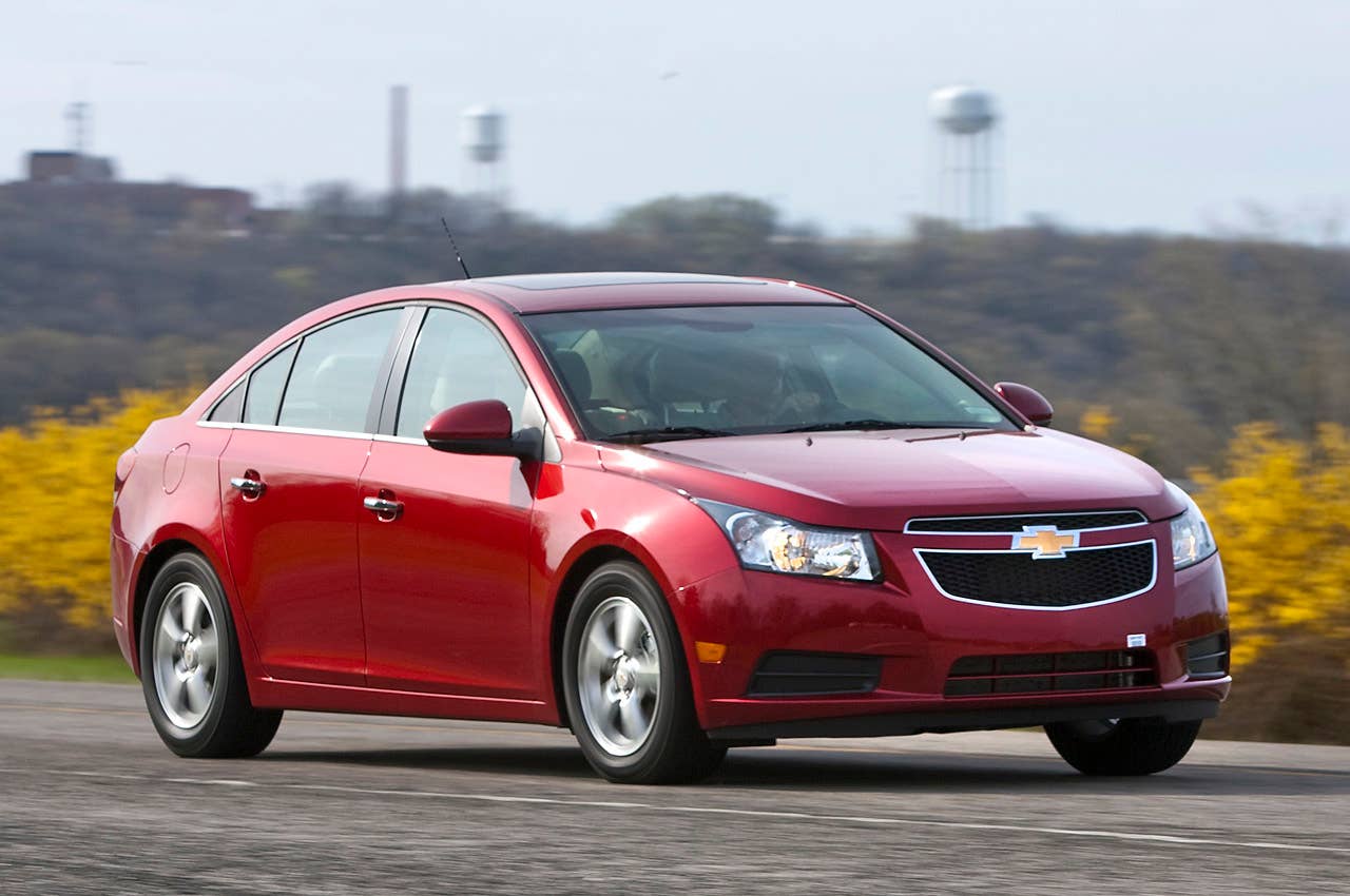 The 2011 Chevrolet Cruze fuel-efficient sedan speeds around the test track Friday, April 16, 2010 in Milford, Michigan. The new Cruze offers class-leading fuel economy, the spaciousness and amenities of a midsize car, and more safety features than other vehicles in it class. (Photo by John F. Martin for Chevrolet)