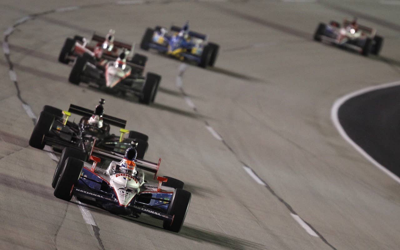 SPARTA, KY - SEPTEMBER 04:  Dan Wheldon of England, driver of the #4 National Guard Panther Racing Dallara Honda, leads a pack of cars during the IndyCar Series Kentucky Indy 300 at Kentucky Speedway on September 4, 2010 in Sparta, Kentucky.  (Photo by Streeter Lecka/Getty Images) *** Local Caption *** Dan Wheldon