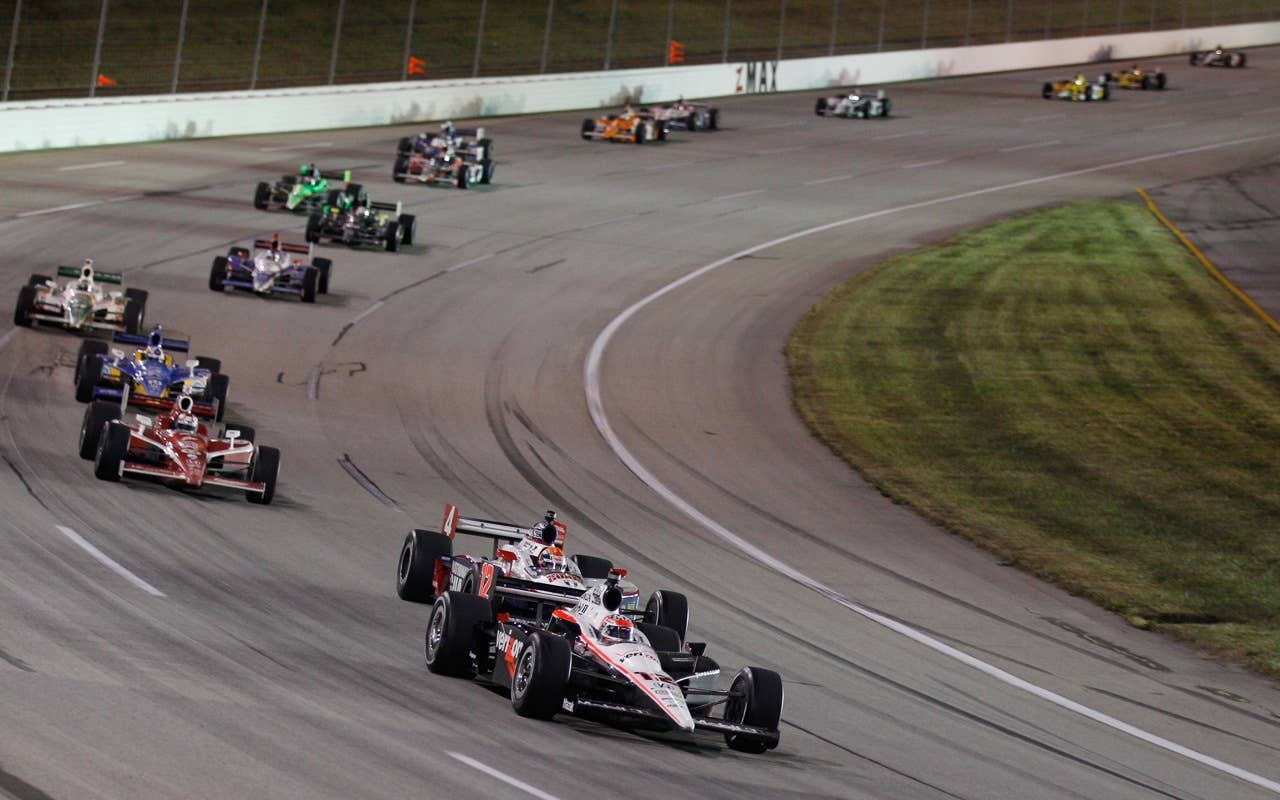 SPARTA, KY - SEPTEMBER 04:  Will Power of Australia, driver of the #12 Verizon Team Penske Dallara Honda leads a pack of cars during the IndyCar Series Kentucky Indy 300 on September 4, 2010 in Sparta, Kentucky.  (Photo by Chris Graythen/Getty Images) *** Local Caption *** Will Power