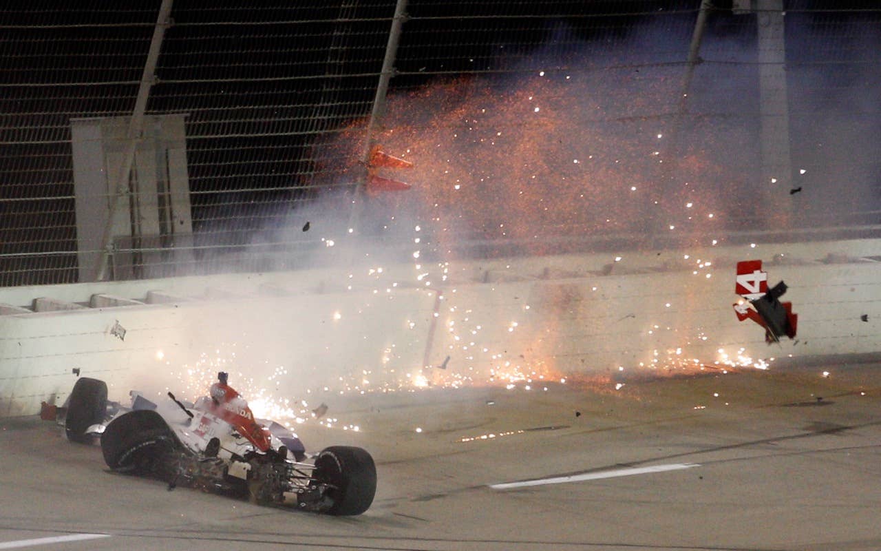 SPARTA, KY - SEPTEMBER 04:  Vitor Meira of Brazil, driver of the #14 ABC Supply Co. A.J. Foyt Racing Dallara Honda catches on fire as he wrecks on turn three during the IndyCar Series Kentucky Indy 300 on September 4, 2010 in Sparta, Kentucky.  (Photo by Chris Graythen/Getty Images) *** Local Caption *** Vitor Meira