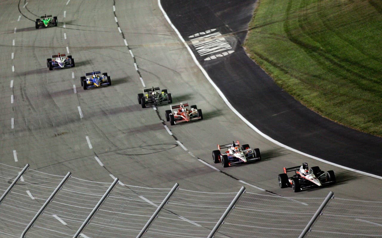 SPARTA, KY - SEPTEMBER 04:  Will Power of Australia, driver of the #12 Verizon Team Penske Dallara Honda leads a pack of cars during the IndyCar Series Kentucky Indy 300 on September 4, 2010 in Sparta, Kentucky.  (Photo by Chris Graythen/Getty Images) *** Local Caption *** Will Power