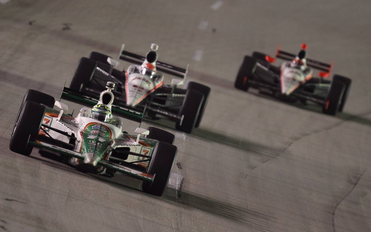 SPARTA, KY - SEPTEMBER 04:  Tony Kanaan of Brazil, driver of the #11 Team 7-Eleven Andretti Autosport Dallara Honda, leads a pack of cars during the IndyCar Series Kentucky Indy 300 at Kentucky Speedway on September 4, 2010 in Sparta, Kentucky.  (Photo by Streeter Lecka/Getty Images) *** Local Caption *** Tony Kanaan