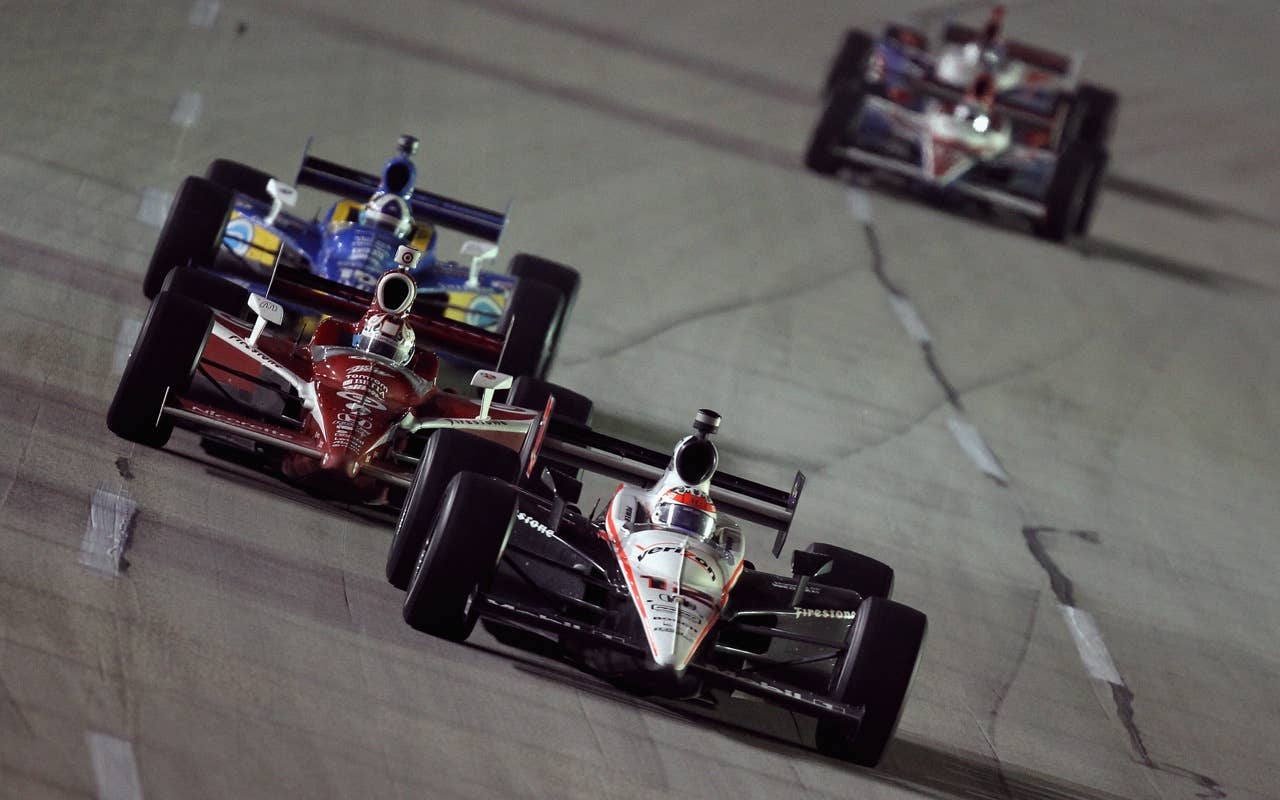 SPARTA, KY - SEPTEMBER 04:  Will Power of Australia, driver of the #12 Verizon Team Penske Racing Dallara Honda, leads a pack of cars during the IndyCar Series Kentucky Indy 300 at Kentucky Speedway on September 4, 2010 in Sparta, Kentucky.  (Photo by Streeter Lecka/Getty Images) *** Local Caption *** Will Power