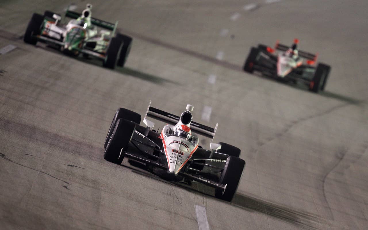 SPARTA, KY - SEPTEMBER 04:  Ryan Briscoe of AUstralia, driver of the #6 Team Penske Dallara Honda, leads a pack of cars during the IndyCar Series Kentucky Indy 300 at Kentucky Speedway on September 4, 2010 in Sparta, Kentucky.  (Photo by Streeter Lecka/Getty Images) *** Local Caption *** Ryan Briscoe