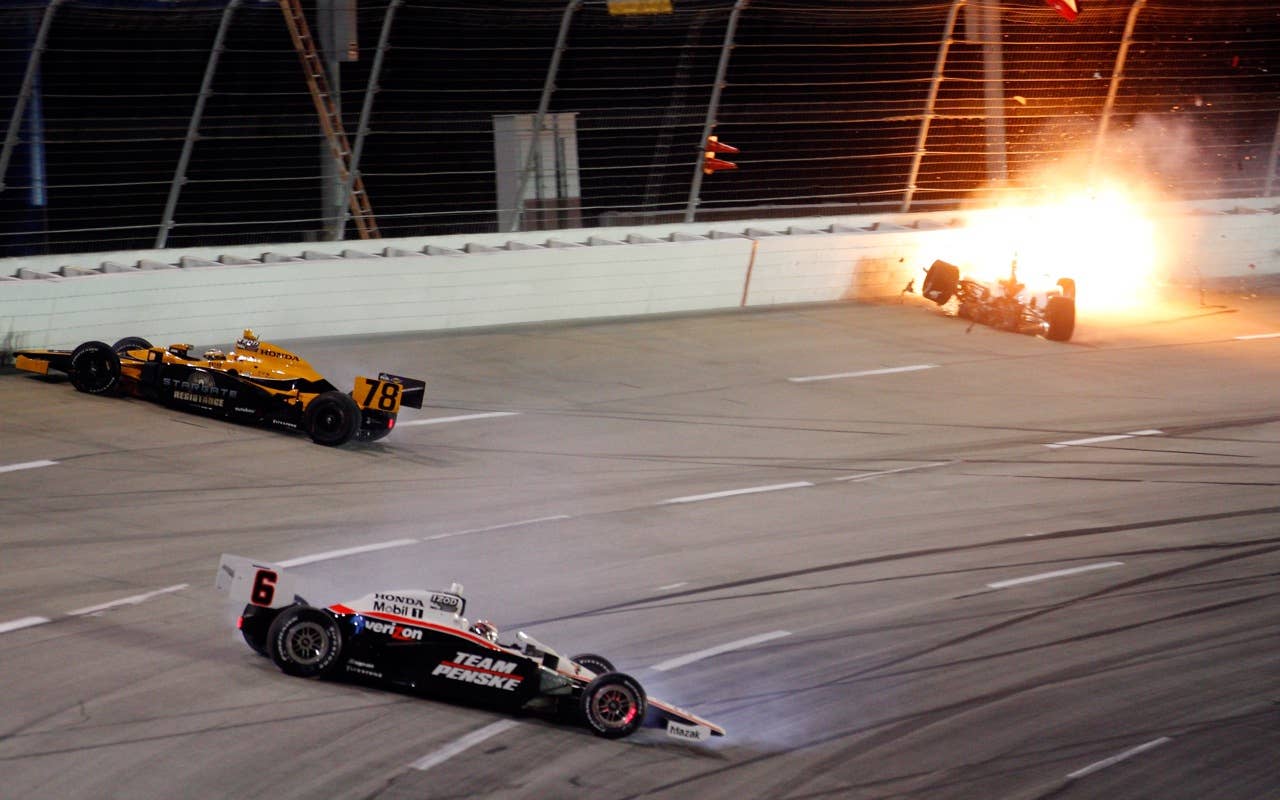 SPARTA, KY - SEPTEMBER 04:  Vitor Meira of Brazil, driver of the #14 ABC Supply Co. A.J. Foyt Racing Dallara Honda catches on fire as he wrecks on turn three during the IndyCar Series Kentucky Indy 300 on September 4, 2010 in Sparta, Kentucky.  (Photo by Chris Graythen/Getty Images) *** Local Caption *** Vitor Meira