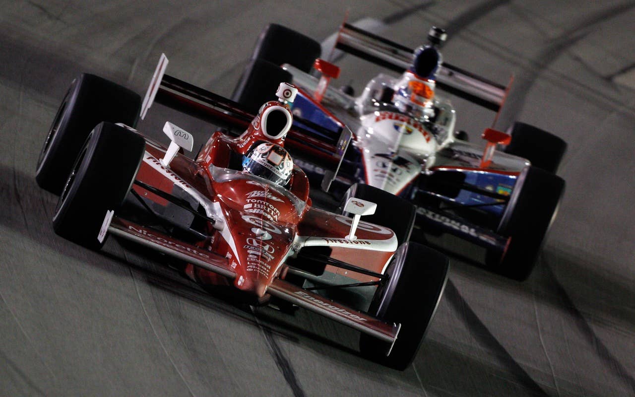 SPARTA, KY - SEPTEMBER 04:  Scott Dixon of New Zealand, driver of the #9 Target Chip Ganassi Racing Dallara Honda leads Dan Wheldon of England, driver of the #4 National Guard Panther Racing Dallara Honda during the IndyCar Series Kentucky Indy 300 on September 4, 2010 in Sparta, Kentucky.  (Photo by Chris Graythen/Getty Images) *** Local Caption *** Scott Dixon;Dan Wheldon