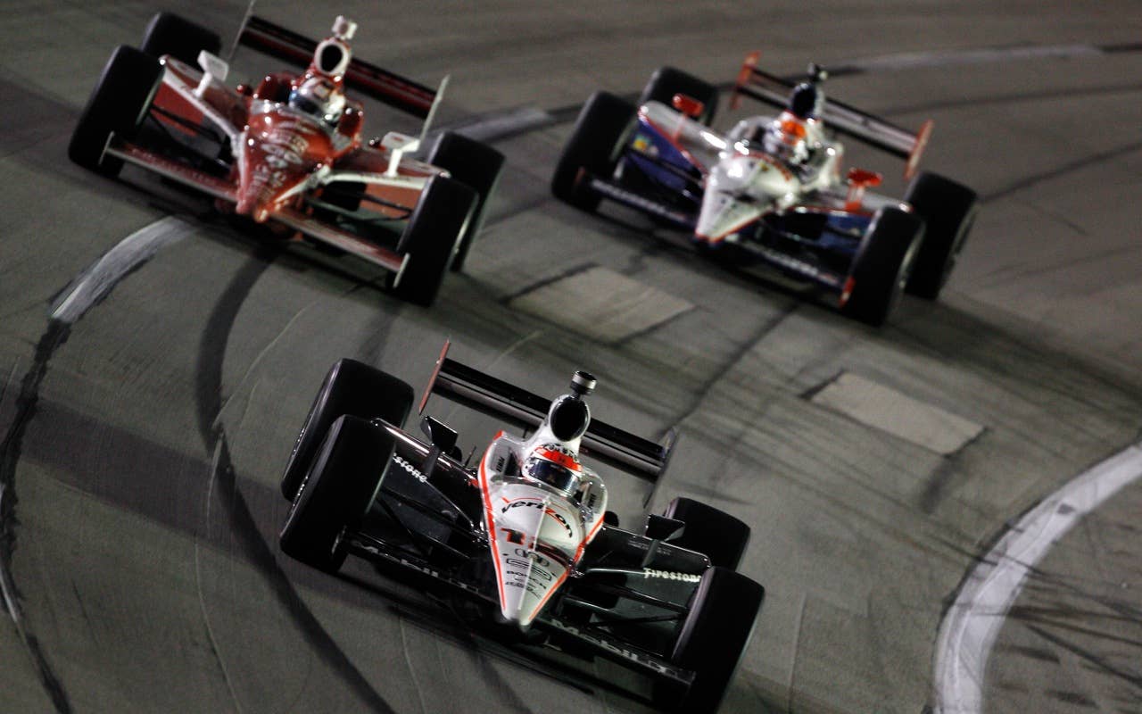 SPARTA, KY - SEPTEMBER 04:  Will Power of Australia, driver of the #12 Verizon Team Penske Dallara Honda leads a pack of cars during the IndyCar Series Kentucky Indy 300 on September 4, 2010 in Sparta, Kentucky.  (Photo by Chris Graythen/Getty Images) *** Local Caption *** Will Power