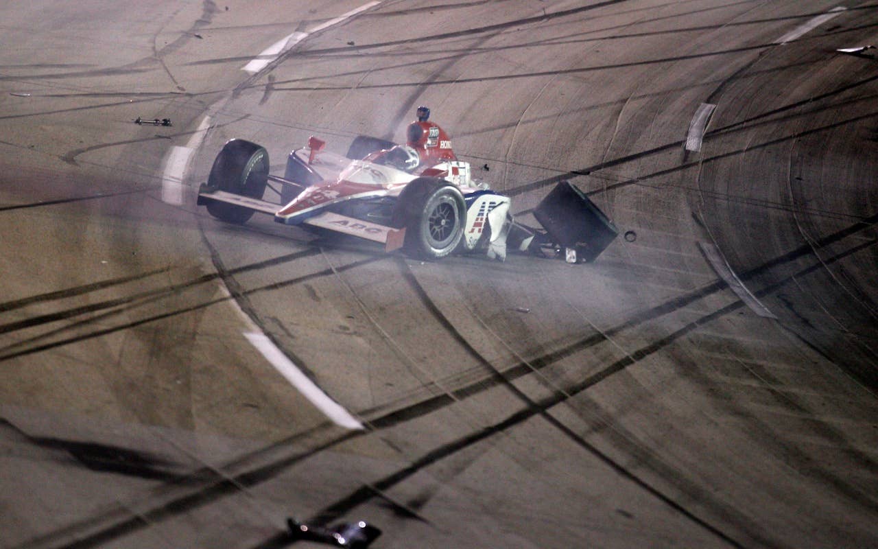 SPARTA, KY - SEPTEMBER 04:  Vitor Meira of Brazil, driver of the #14 ABC Supply Co. A.J. Foyt Racing Dallara Honda catches on fire as he wrecks on turn three during the IndyCar Series Kentucky Indy 300 on September 4, 2010 in Sparta, Kentucky.  (Photo by Chris Graythen/Getty Images) *** Local Caption *** Vitor Meira
