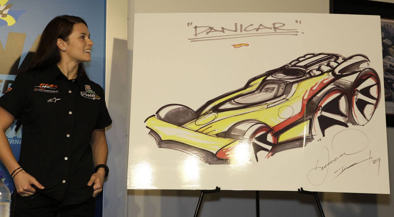 Danica Patrick unveiled a sketch of the Hot Wheels "Danicar" during a press conference, at the Daytona International Speedway, announcing Hot Wheels return to NASCAR through a partnership with JR Motorsports  in Daytona Beach, Fla., Saturday, February 6, 2010. (AP Photo/Julie Fletcher)
