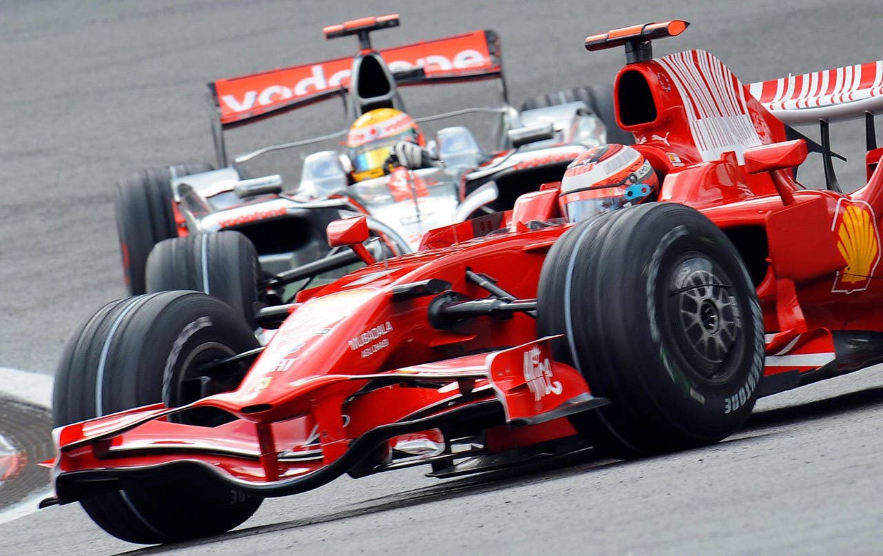 Ferrari's Finnish driver Kimi Raikkonen drives ahead of McLaren Mercedes' British driver Lewis Hamilton at the Spa-Francorchamps racetrack on September 7, 2008, during the Belgium Formula One Grand Prix. AFP PHOTO / BERTRAND GUAY (Photo credit BERTRAND GUAY/AFP/Getty Images)