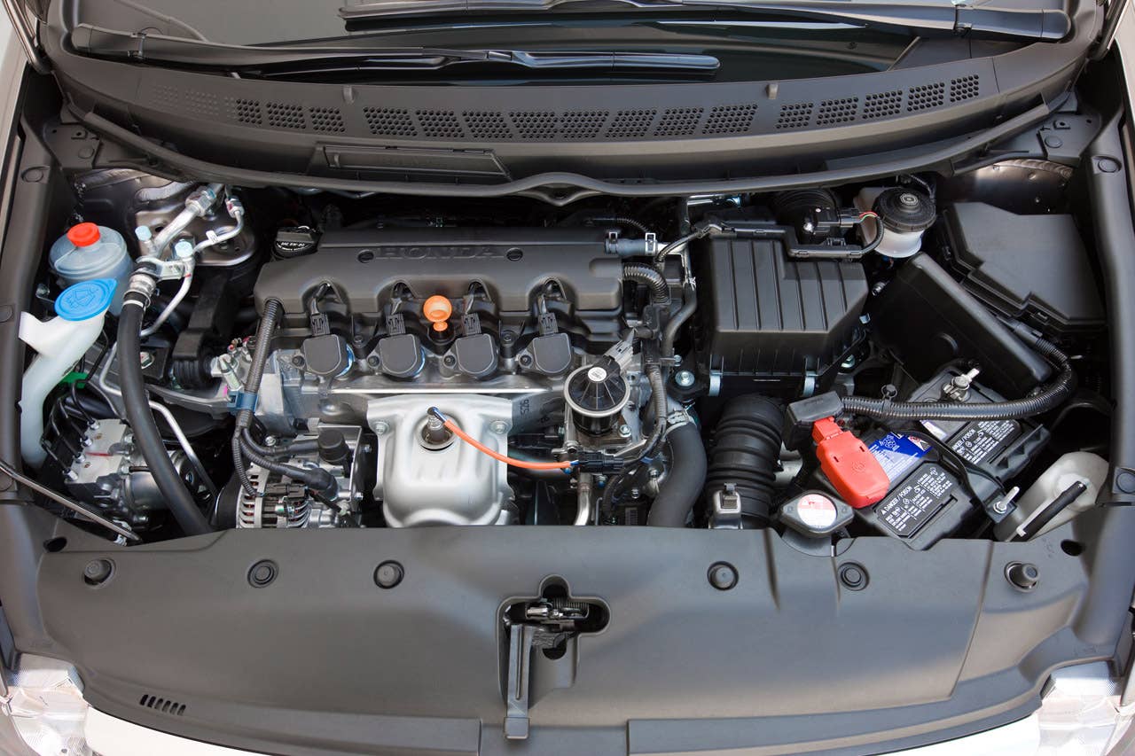 2010 Honda Civic EX-L Sedan with Navigation (exterior matches Civic EX Sedan). 1.8-liter i-VTEC engine.